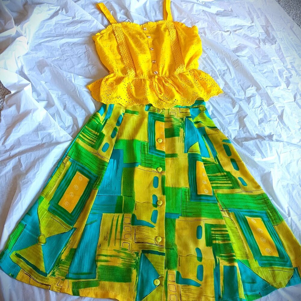 YELLOW COTTON EYELET TOP, L. & BLUE ARTSY PRINT YELLOW BUTTON-DOWN SKIRT, M.